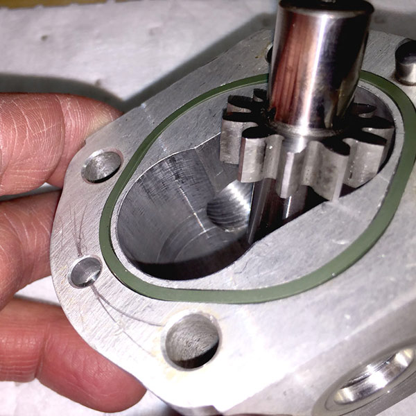 Oil contamination can damage internal components, like the damage seen on this gear pump. The increased friction and wear between the pump’s rotating group against its housing or wear components can cause localized noise, chatter, and vibration above and beyond the usual noise generated by pumps and other components. Image courtesy of CD Industrial Group/LunchBox Sessions